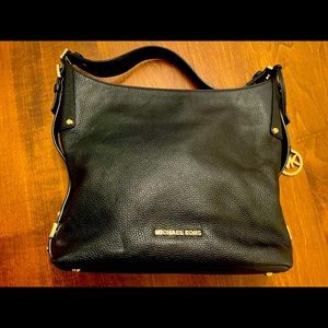 Very lightly used Michael Kors bag with gold hardware accents